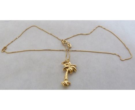 A palm tree pendant and necklace chain. In gold marked 750. 2.9g