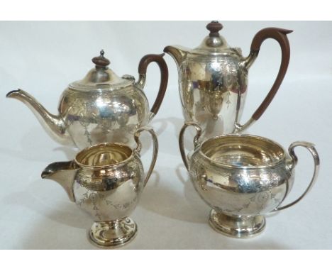 A George V four piece silver tea service by Walker and Hall, comprising teapot, coffee pot, sucrier, and cream jug with brigh