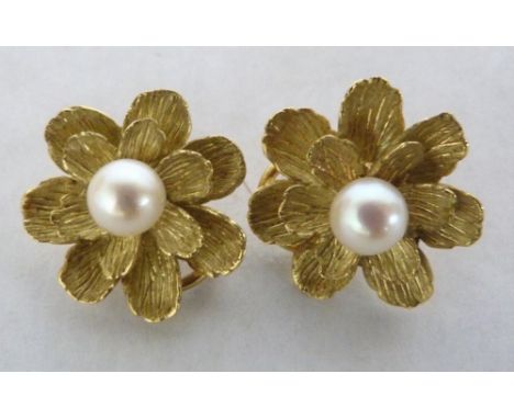 A pair of flowerhead pearl earrings. In gold. Marks indistinct. 12.5g gross