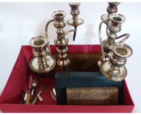 A pair of plated three light candelabra and a collection of cased and loose cutlery