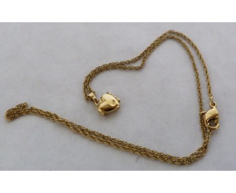 A heart locket and necklace chain. In gold marked 9ct.