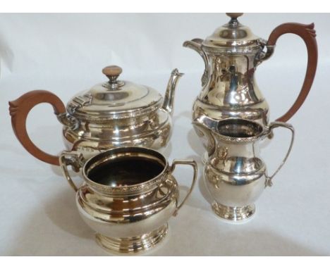 A George VI four piece silver tea service comprising a teapot, a hot water jug, milk jug and sucrier. Birmingham 1941. 48ozs 