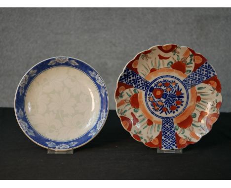 A late 19th/early 20th century Japanese Imari scalloped edged plate decorated with panels of flowers; together with an early 