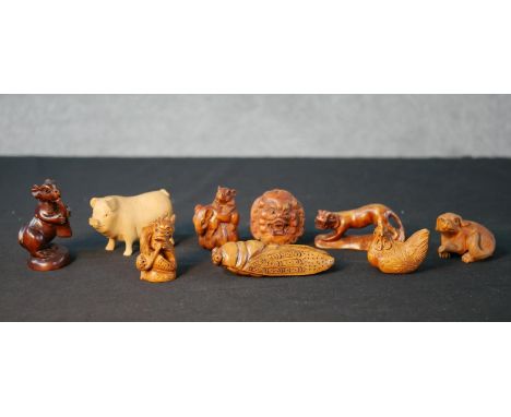 Nine assorted 20th century carved boxwood Japanese netsuke comprised of Hare, Pig, Dragon, Rat, Cricket, Panther, Chicken, Do