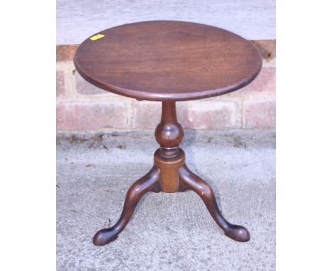 A late Georgian mahogany miniature tilt top table, on turned column and tripod splay support with pad feet, 11" dia