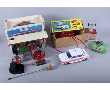 A Mamod steam tractor, a Mamod miniature grinding machine, a Quickstart diesel engine and a remote controlled police car, all