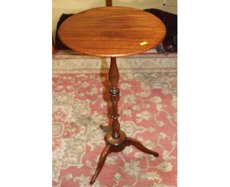 A 19th century fruitwood occasional table, on turned column and tripod splay support, 14" dia