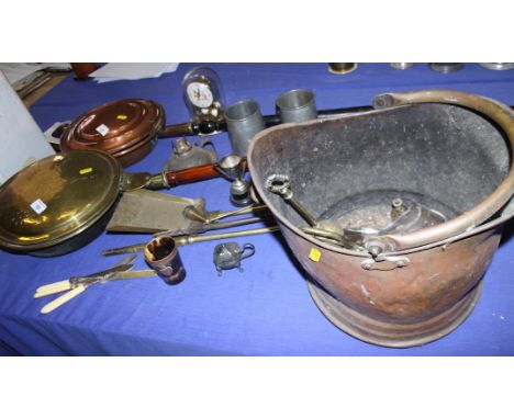 A copper coal helmet, two warming pans, a brass door stop and various other metalwares