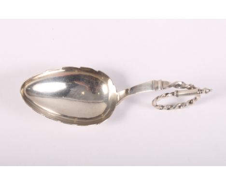 A Danish silver leaf-shaped caddy spoon with scroll handle