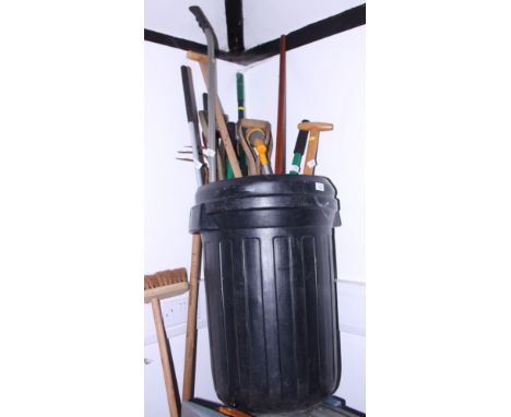 A collection of garden hand tools, forks, spades, edging shears, etc
