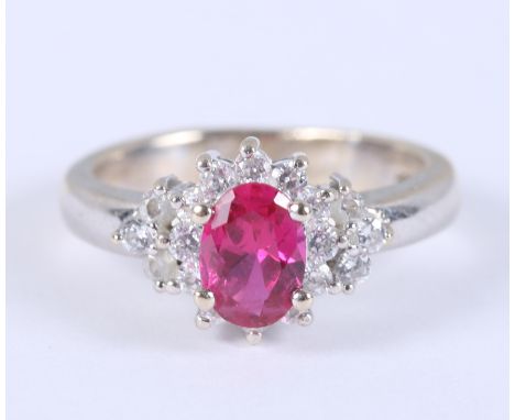 A white metal (stamped 750),&nbsp;ruby and diamond cluster ring, size J, 4.5g