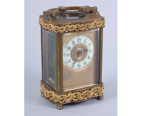 A French gilt cased carriage clock with white enamel dial and Arabic numerals, 4 3/4" high