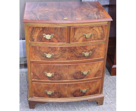 A figured walnut bowfront chest of two short and three long graduated drawers, on bracket feet, 24" wide
