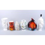 An Anita Harris vase, a Poole Pottery vase (damages), a Portmeirion vase, a white glazed relief