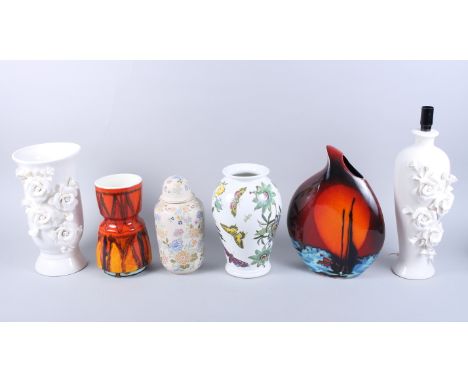 An Anita Harris vase, a Poole Pottery vase (damages), a Portmeirion vase, a white glazed relief flower decorated lamp, a simi