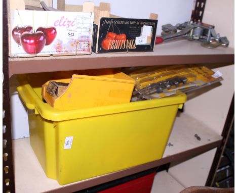 A red painted cantilever toolbox, containing a quantity of sockets, drill bits, etc, a collection of other tools, a pair of S