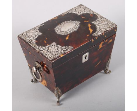 A late 19th century silver mounted tortoiseshell tea caddy, on scroll feet, 5" wide