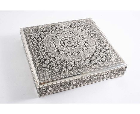 A MID 20TH CENTURY PERSIAN CIGAR BOX of shallow square outline on small bracket feet with a profusely chased cover, struck wi