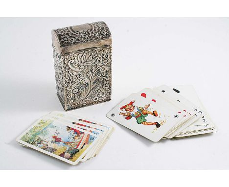 A LATE VICTORIAN PLAYING CARDS BOX with a domed cover, a vacant cartouche & profusely chased decoration, the gilt interior co