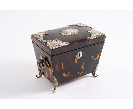 A LATE MOUNTED TORTOISESHELL TEA CADDY with drop ring handles, scroll feet and a vacant cartouche on the cover, maker's mark 