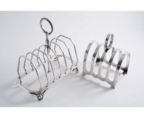A VICTORIAN SEVEN BAR TOAST RACK with a beaded ring handle and four openwork scroll feet, maker's mark "J.G", Birmingham 1876