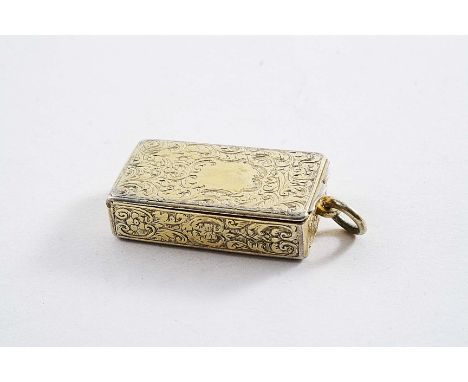 AN EARLY VICTORIAN SILVERGILT ENGRAVED VESTA CASE rectangular with a ribbed striker down one side & a suspensory ring, the co