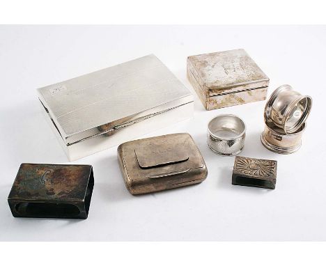 A MIXED LOT:- An engine-turned cigarette box, initialled, a smaller plain cigarette box, three napkin rings (one initialled),