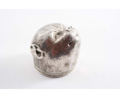 A CONTINENTAL NOVELTY SNUFF BOX in the form of a dog mask, the hinged cover with a stamped border of repeating anthemion moti