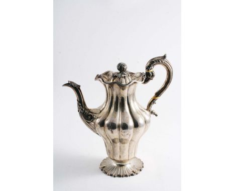 A WILLIAM IV SCOTTISH COFFEE POT of baluster form with fluting, a chased & matted foot and a wavy rim, the cover with a fruit