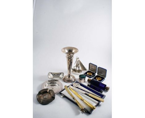 A MIXED LOT:- An ashtray, a small dish, inscribed, three various knives, a single vase, a paper knife (in a fitted case), a b