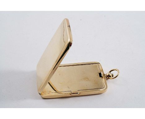 A PLAIN 9 CT. GOLD POWDER COMPACT rectangular with a suspensory ring, hinged cover, internal compartment with cover & mirror,