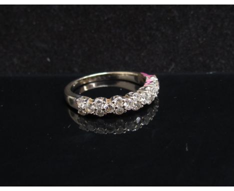 An 18ct gold diamond half hoop ring (one diamond missing) Size Q, 3.8g