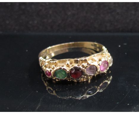 A 9ct gold multi stone set ring set with six stones including emerald. Size N, 2.6g