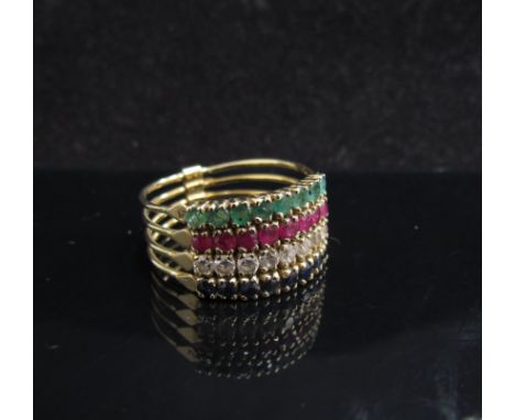 A ring made from four bands of emerald, rubies, sapphires and clear stones. Size T, 4.5g