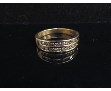 A 9ct gold ring with two rows of diamonds. Size P/Q, 3.8g