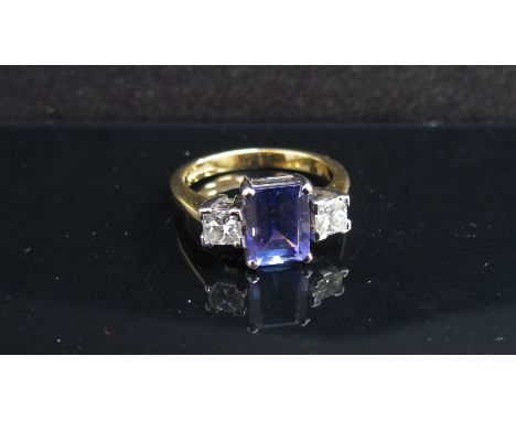 An 18ct gold tanzanite and diamond ring. Size M/N, 4.5g