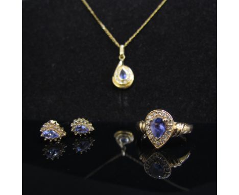 A gold tanzanite and diamond ring the pear cut tanzanite framed by diamonds. Size N, 4.1g with a similar pendant hung on 9ct 