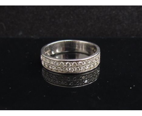 An 18ct white gold half hoop ring with two rows of diamonds. Size Q/R, 5.2g