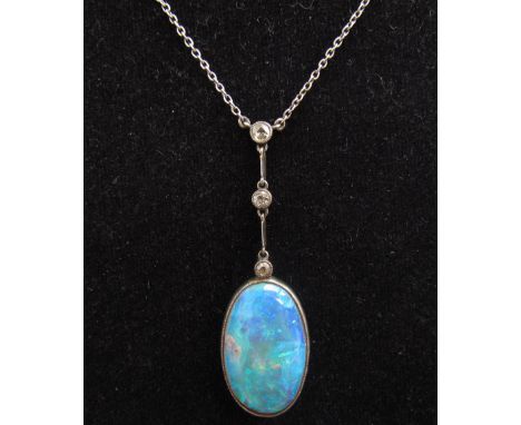 An opal pendant hung on a drop with three old cut diamonds 4.5cm drop hung on chain, 36cm long unmarked, 4.7g