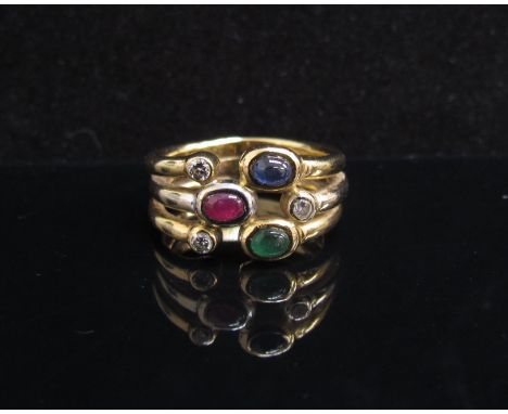 A gold ring with cabochon ruby, emerald, diamond and sapphire set in open bands, stamped 750. Size P, 11.6g