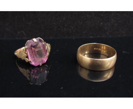 A 9ct gold wedding band. Size M and a gold ring set with amethyst coloured stone stamped 9ct. Size L, 5.2g