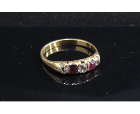 A gold ruby and diamond ring, marks rubbed. Size M, 2.1g