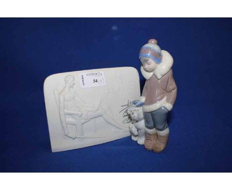 LOT OF LLADRO FIGURESincluding a Lladro Collector's Society bisque plaque, two bisque bells, a polar bear figure and an Inuit