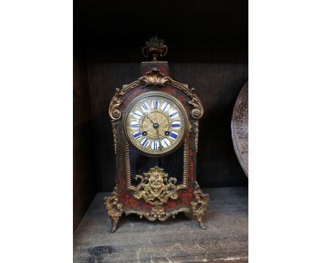 A late 19th century, Louis XVI style, tortoiseshell boulle mantel clock, striking on a bell, 36cm high, with pendulum. 