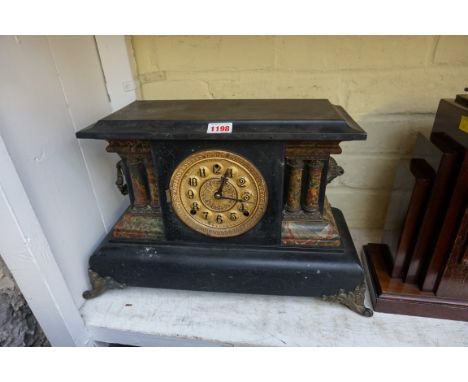 An American ebonized and simulated marble mantel clock, by E N Welch, 46.5cm wide, lacking pendulum bob.&nbsp; &nbsp; 
