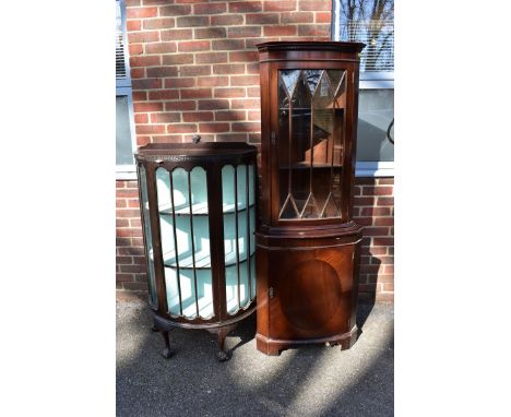 A bowfront display cabinet; together with a reproduction corner cupboard, 180cm high x 66cm wide; and a mahogany book trough.