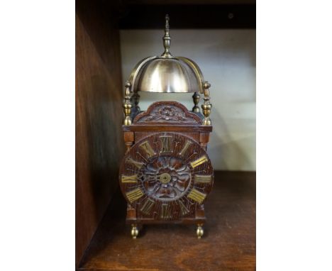 An early 20th century carved oak and brass mounted lantern style clock,&nbsp;29.5cm high. 