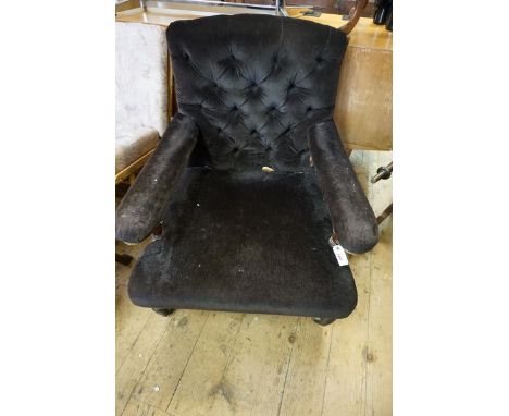 A Victorian walnut and button upholstered open arm occasional chair, by Howard &amp; Sons,&nbsp;both&nbsp;rear casters stampe