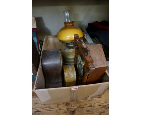 Three various mantel clocks and an oil lamp. 