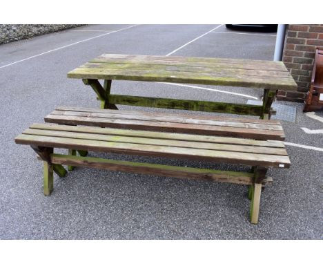 A teak garden table; together with a pair of bench seats.Collection of this lot is strictly by appointment on Saturday 17th A